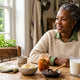 Woman at a kitchen table with fermented foods — 40 billion CFU probiotics explained