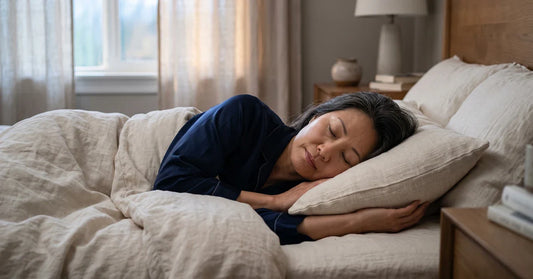 Woman sleeping peacefully in linen bedding at dawn — magnesium glycinate and sleep